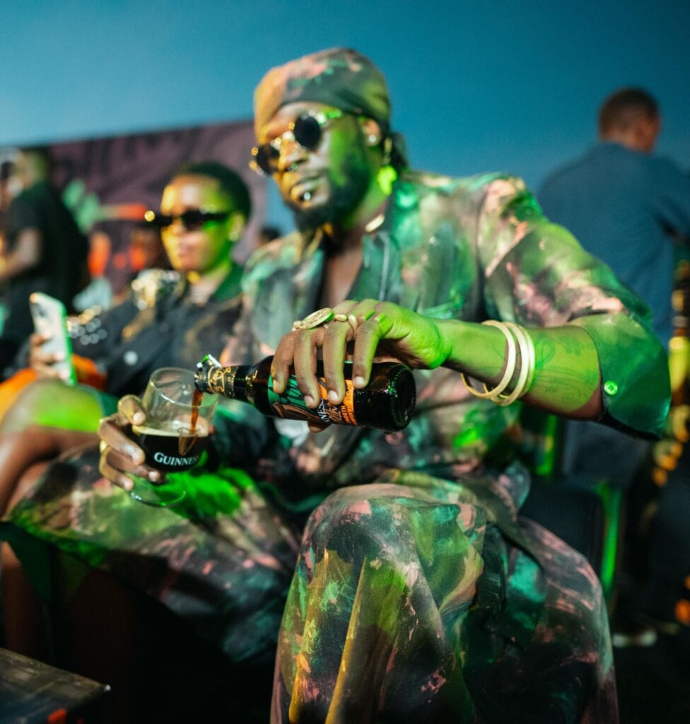 Musician Elijah Kitaka pours his Guiness Smooth at the Make It Yours launch
